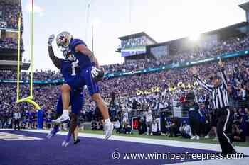 Washington pulls away in 4th quarter to beat No. 10 Michigan 27-17