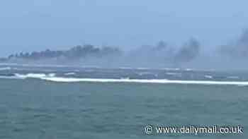 New Zealand Navy's HMNZS Manawanuisinks after running aground on a reef and catching fire