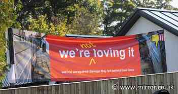 Furious mum puts up banner at new McDonald's after builders 'destroy' her fence