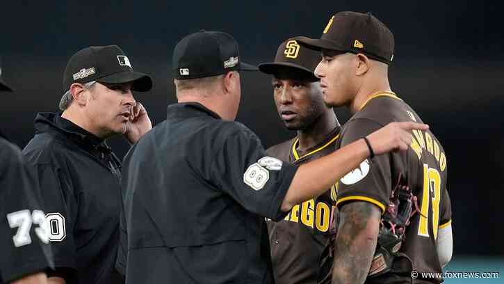 Padres' NLDS Game 2 win over Dodgers turns ugly as fans throw objects at San Diego players