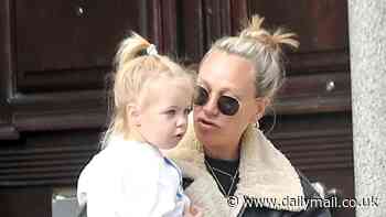 Chloe Madeley is in high spirits as she visits a toy shop with her daughter Bodhi, two, and blows bubbles outside