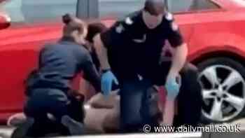 Wild moment police punch and kneel on man as they take him down in brutal arrest in Broadmeadows, Melbourne