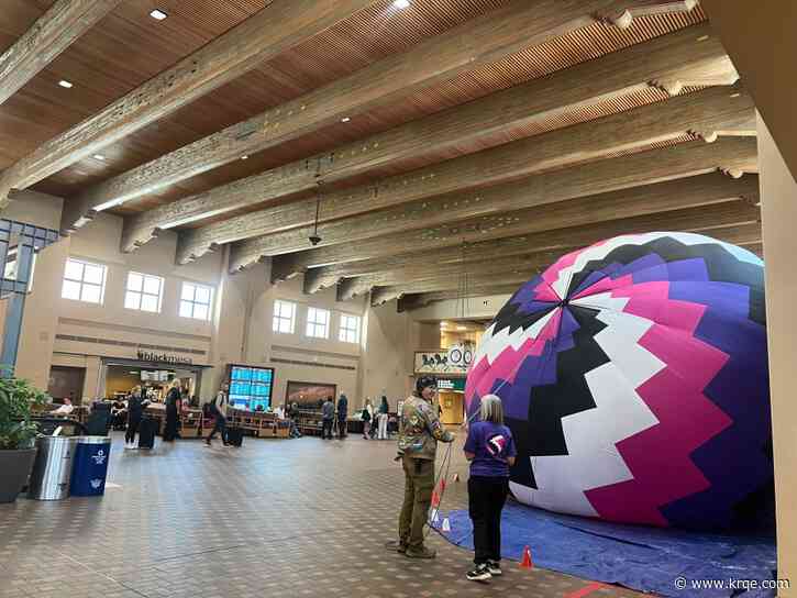 RC balloons greet passengers at the Sunport for Balloon Fiesta