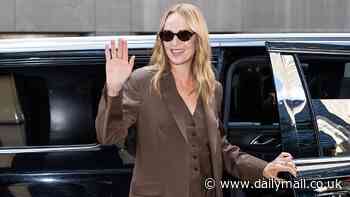 Uma Thurman proves she's still the queen of cool at 54 in shades and chic three-piece suit