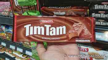 Coles and Woolworths refuse to answer questions about why Tim Tams are cheaper to buy overseas