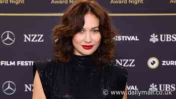 Bond girl Olga Kurylenko exudes old Hollywood glamour in a sequinned black dress as she attends the Zurich Film Festival