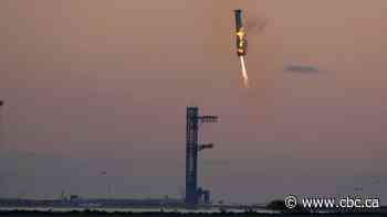 Launch tower's 'chopsticks' catch descending rocket booster as SpaceX launches Starship