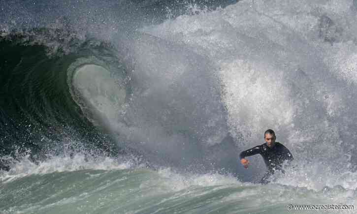 PHOTOS: Big surf brings big action to the coast