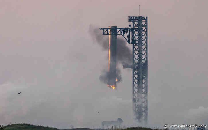 In a first, SpaceX ‘catches’ megarocket booster after test flight