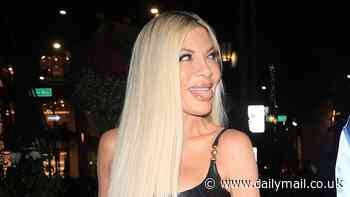 Tori Spelling playfully sticks out her tongue while leaving an Versace party in Beverly Hills