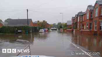 Flash flooding closes roads and blocks rail lines