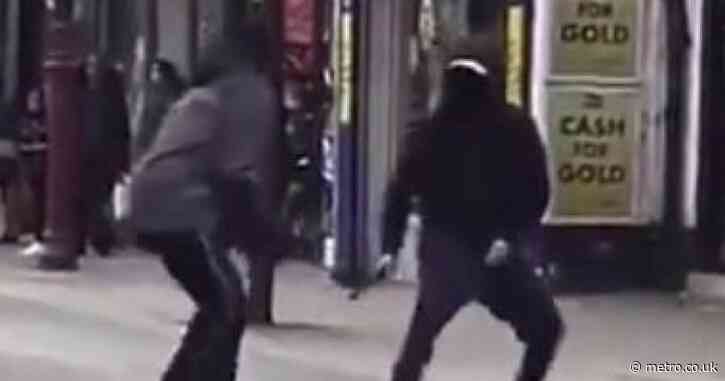 Machete fight breaks out in front of children on packed London high street 