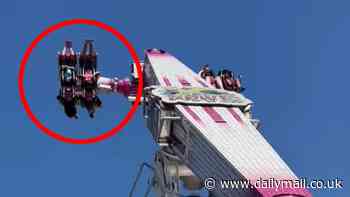 Mom watches on in horror as her young children dangle upside down on malfunctioning fair ride for 15 minutes