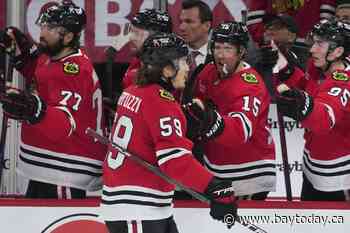 Bertuzzi helps Chicago beat San Jose 4-2 in the Blackhawks' home opener