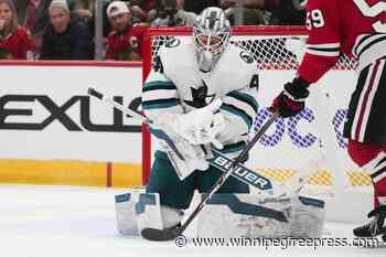 Bertuzzi helps Chicago beat San Jose 4-2 in the Blackhawks’ home opener