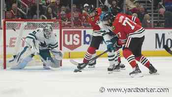 Blackhawks double up Sharks for win in home opener