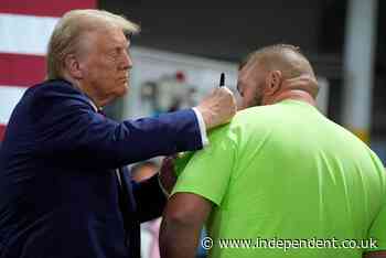 Trump awkwardly forced to pace the stage after mic goes out at Detroit rally: Live