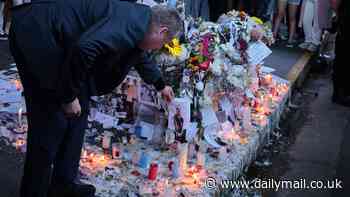 Liam Payne's heartbroken father Geoff reads tributes left by fans outside hotel where One Direction star fell to his death