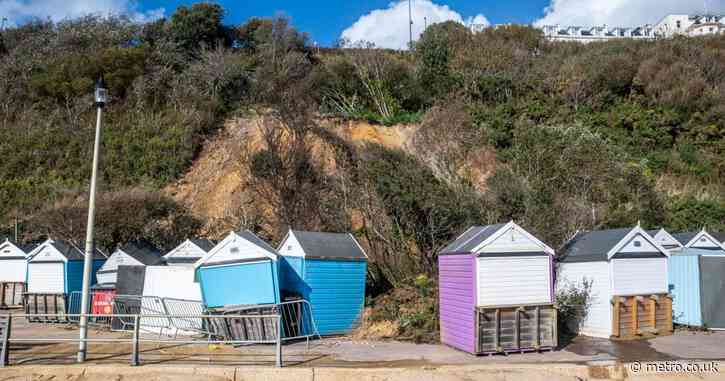 Landslide collapses onto popular beach just inches away from tourists