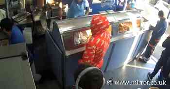 Dramatic moment fish and chip shop staff wrestle knife-wielding robber to the floor