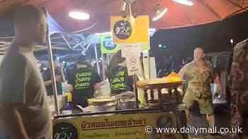 Instant karma for British tourist after he ignores 'no smoking' sign and lights a cigarette next to food stall gas stoves 