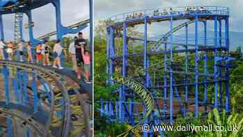 Stranded roller-coaster riders forced to walk along tracks high above the ground after power outage