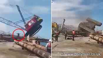 Heart-stopping moment worker barely escapes being crushed as towering crane collapses