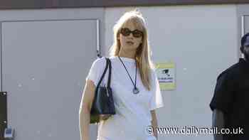 Jennifer Lawrence shows off her baby bump in a white shirt as she takes son Cy, two, to a Los Angeles park