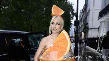 Pixie Lott goes all out for Halloween by dressing up as an Aperol Spritz as she arrives at exclusive Mayfair members club for lavish bash