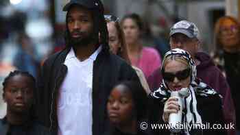 Madonna, 66, looks unrecognizable in a head scarf and coat while out with boyfriend Akeem Morris, 28, in NYC