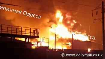 Moment Ukrainian warehouse full of Western ammunition bursts into flames after Russian missile strike - as Kremlin claims to have seized villages in Donetsk region