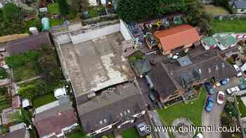 Pictures show flat section where 'Britain's biggest man cave' once stood: Demolition brings an end to a decade-long planning row between millionaire and his neighbours