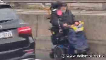 Strife in the fast lane: Shocking moment pensioner in a mobility scooter is seen trundling the wrong way down a motorway