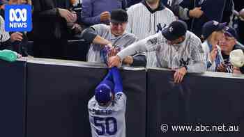 Yankees fans booted from the stadium after ripping ball from star's glove in bizarre World Series scenes