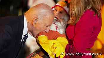 Biden bites a baby's leg and Jill wears a full Panda suit as White House goes spooky for trick-or-treating