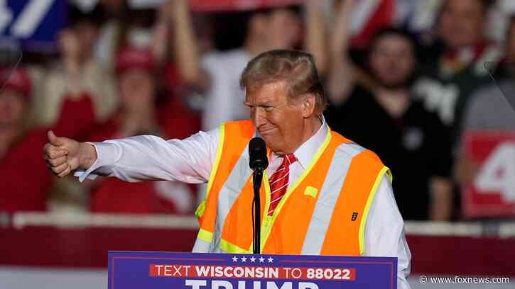 Donald Trump wears garbage worker vest to rally in critical swing state