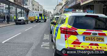 Live: Police close A259 as man 'throws items out of window and spits at people'