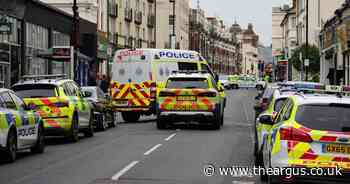 Road reopens after riot police deal with man 'spitting and throwing things'