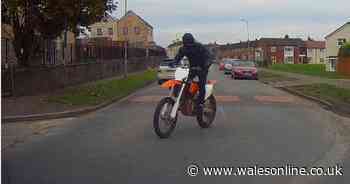 Police want to speak to masked biker after brick thrown at police car