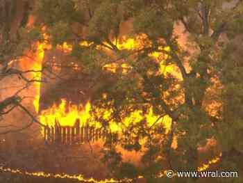 Authorities responding to fire behind building in Durham