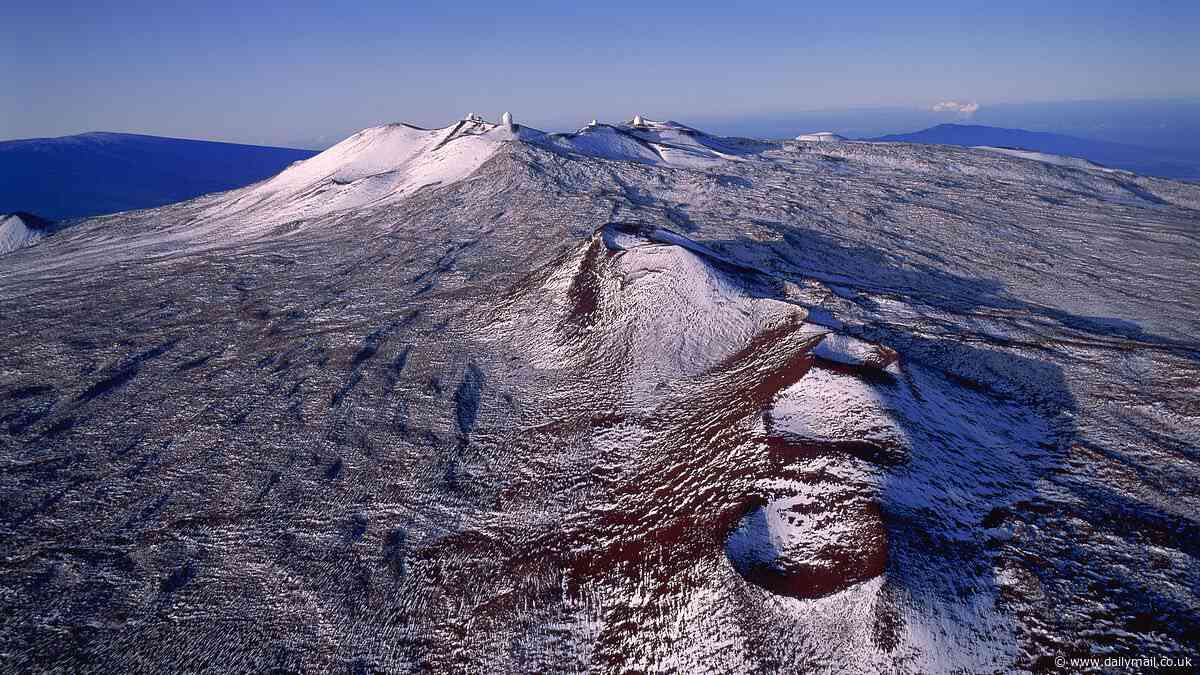 Hawaii summit blanketed in snow in rare cold snap