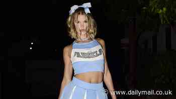 Joy Corrigan shows off physique in skimpy cheerleader outfit with knee-high stockings for Halloween