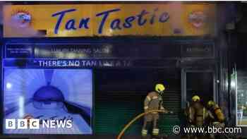 Second man arrested after fire at tanning salon