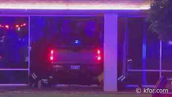 One injured after vehicle crashes into building