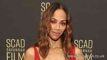 Zoe Saldana goes braless in a plunging red hot dress as she attends the 27th SCAD Savannah Film Festival