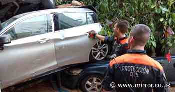 Woman found alive trapped in car beside body of sister three days after floods devastated Valencia