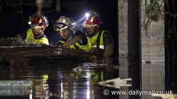 Valencia flood miracle as woman is found alive after being trapped with her dead sister-in-law for THREE days in their car - as rescue teams continue grim hunt for victims of deadly mega storm