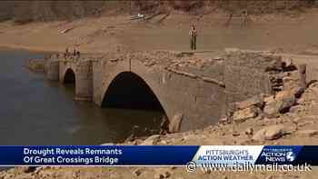 Remnants of 200-year-old bridge and long lost town revealed after lake dries up in state suffering historic drought