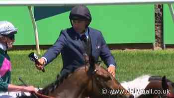 Can you spot the surprising element to footy star turned horse racing reporter Billy Slater's Melbourne Cup attire?