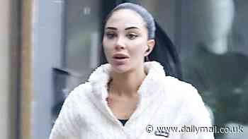 Tulisa keeps it casual in a white zip up fleece as she enjoys a pampering session at the nail salon in preparation for the I'm A Celeb jungle